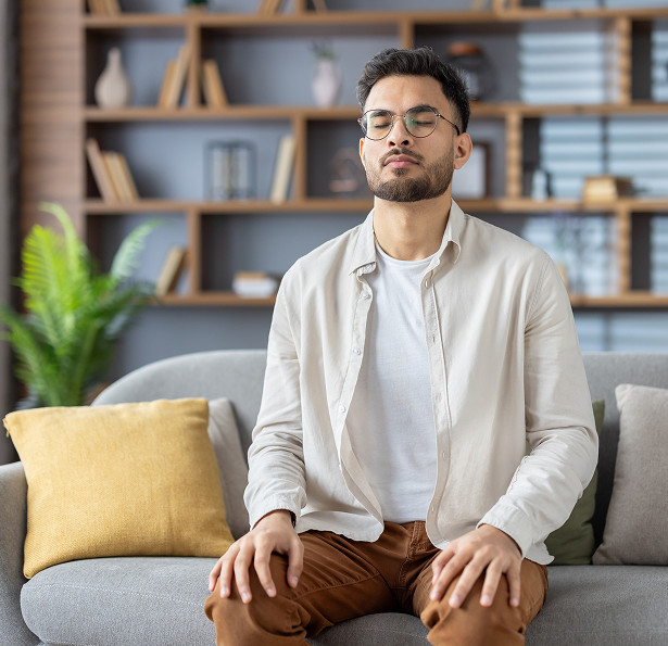 Man sitting with eyes closed
